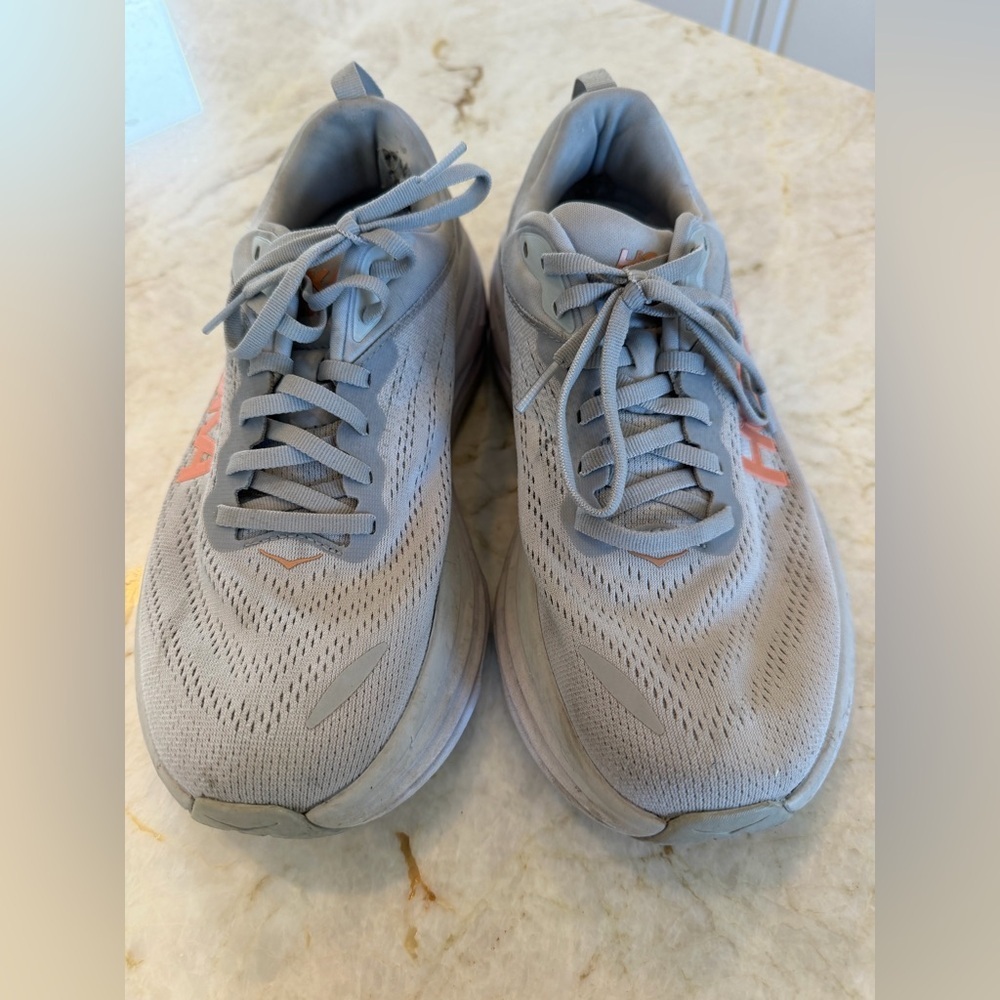 Light Gray hokas Running Shoes with Orange Accent
Size 9D bondi 8
